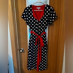 Polka dot dress with bright red accents. Reminiscent of 50’s style.